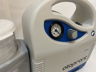 A portable CE marked suction device used to remove ear wax from the ear canal.